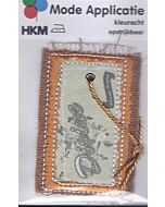 Bruin/beige gekleurde applicatie met rafels en een koort